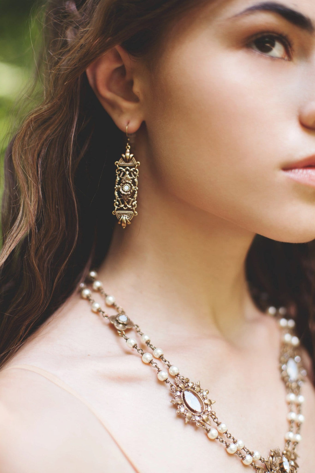 Model Photo: Fontaine Earrings in White Opal and Antiqued Brass by Rabbitwood and Reason